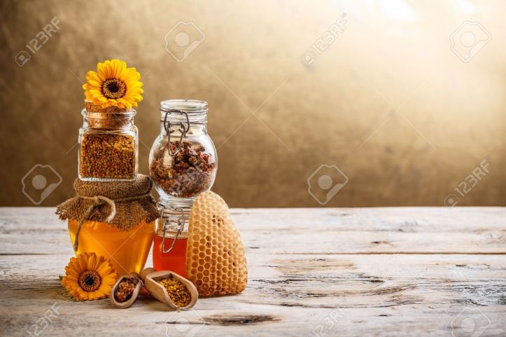 17653053-decorative-display-with-jars-of-fresh-honey-flower-pollen-and-stock-photo
